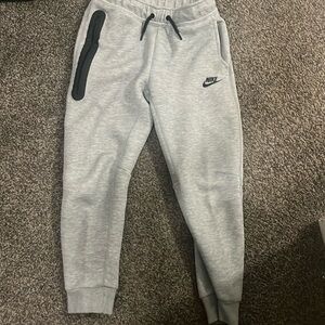 Gray Nike tech pants, size youth, medium